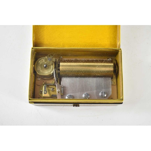 395 - A Reuge music box, the lid decorated with a scene of Rome, together with a further music box with tw... 