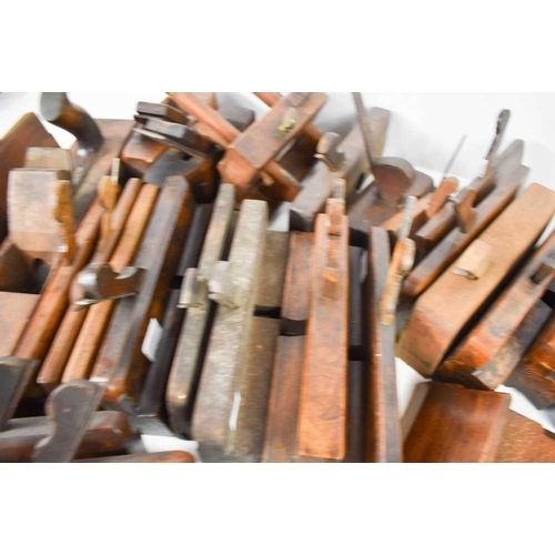 409 - A large collection of 19th century and later woodworking tools, mostly planes, by manufacturers such... 