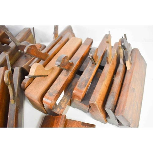 409 - A large collection of 19th century and later woodworking tools, mostly planes, by manufacturers such... 