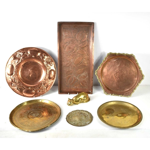 420 - A group of copper and brasswares to include a brass cat ornament, a Scottish Arts and Crafts copper ... 