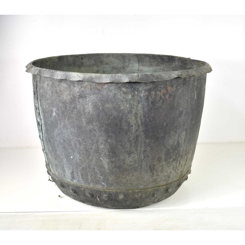 423 - A large Victorian riveted copper cauldron, with flared rim, 40cm high by 53cm diameter.