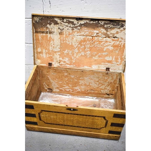 461 - A Victorian painted pine blanket chest with iron strap work and handles and painted simulated satin ... 