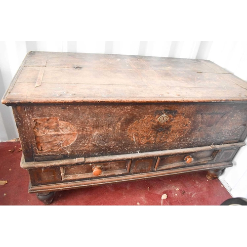 480 - A large Flemish oak coffer, with twin iron handles, two drawer front, and inlaid decoration surround... 