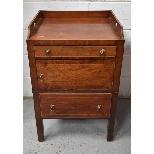 481 - A 19th century mahogany wash stand, with galleried back, two drawers and a cupboard door with lion h... 