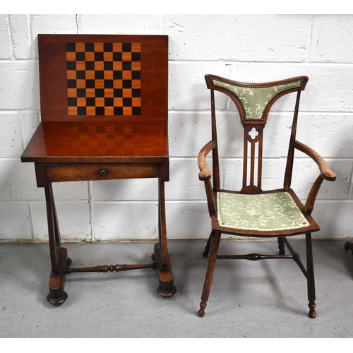 482 - A Victorian mahogany games table with swivel top and inlaid chess board together with an aesthetic m... 