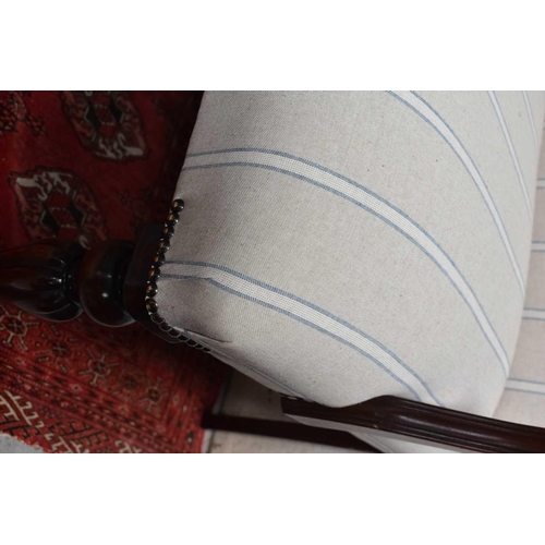 484 - A mahogany framed Georgian style window seat / three seater settee, with newly upholstered striped b... 