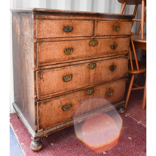 486 - An 18th century walnut chest of two over three drawers, with swan neck handles and brass lock plates... 