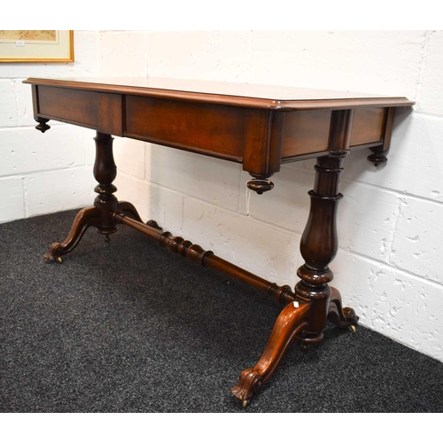 488 - A William IV mahogany library table, with two frieze drawers, pendant finials, the turned columns un... 