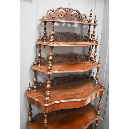 489 - A19th century mahogany waterfall etagere, each of the graduated tiers with shaped shelves and pierce... 