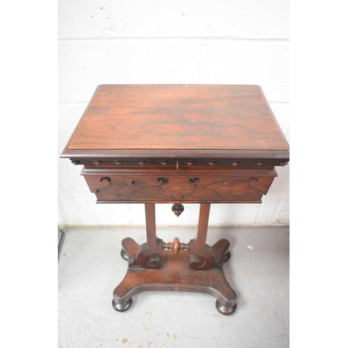 493 - A 19th century rosewood teapoy, the lid opens to reveal a fitted interior of three lined compartment... 