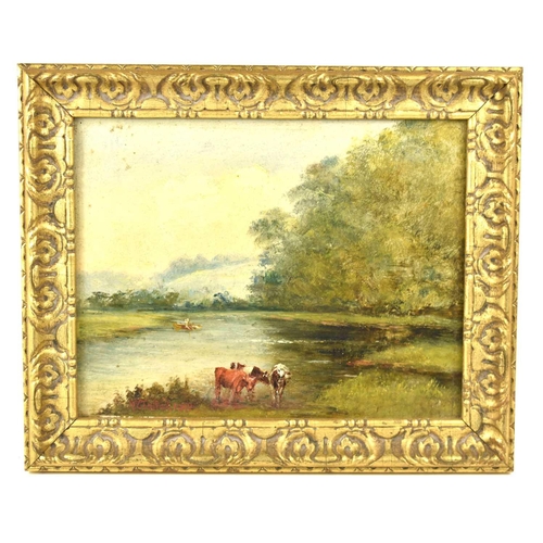 55 - An early 20th century oil on board depicting cattle by the river bank with trees in the background, ... 