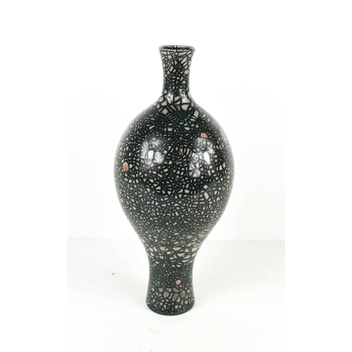 74 - A studio pottery bottle vase, with black over pink crackle glaze, impressed marks under, 25cm high.