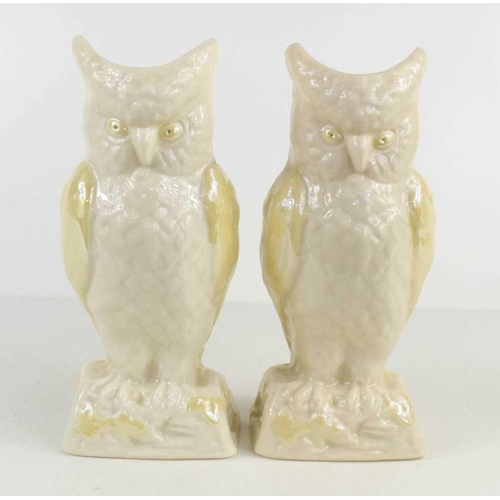 83 - A pair of Belleek owl vases with pale yellow lustre wings and eyes, brown mark verso, 21cm high.