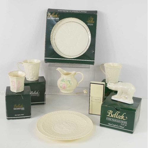 85 - A group of Belleek porcelain comprising a Polar Bear, Georgian Shell Votive, a Claddagh plate, and t... 