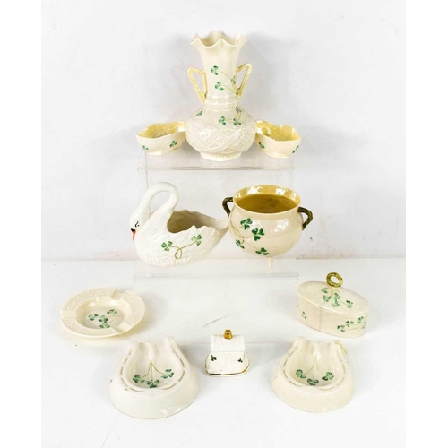 90 - A group of Belleek wares, all decorated with shamrocks, including a twin handled vase 16cm high, cau... 