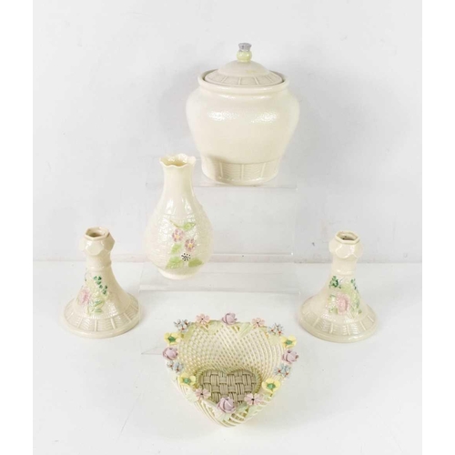94 - A group of Belleek wares, comprising a heart shaped basket the top adorned with flowers, open basket... 