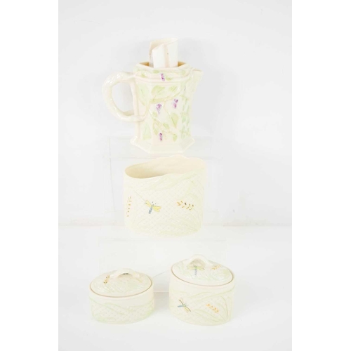 96 - A group of Belleek wares, decorated with dragon flies comprising asymmetric oval vase, and two oval ... 