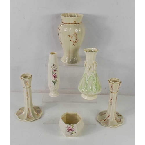 98 - A pair of Belleek porcelain candlesticks decorated with cherry blossom and matching vase, an arum li... 