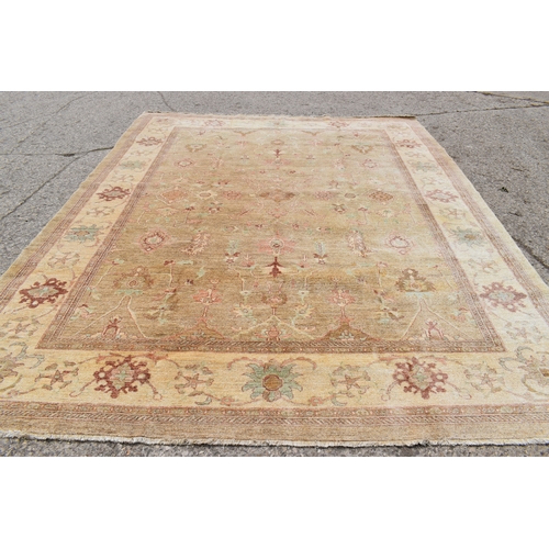 454 - A large Zeigler rug, with a cream ground, decorated with stylised foliate motifs, 4m by 3.17m. This ... 