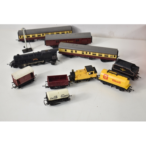 349a - Two OO gauge locomotives together with Triang carriages and a quantity of track.