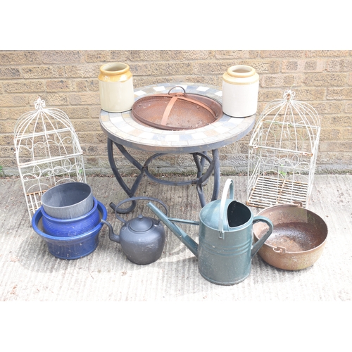 505 - A metal garden fire pit with mosaic tile top together with two stoneware jars, two decorative birdca... 