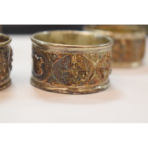 283 - A set of six Indonesian white metal napkin rings in original box marked for Rangoon together with on... 