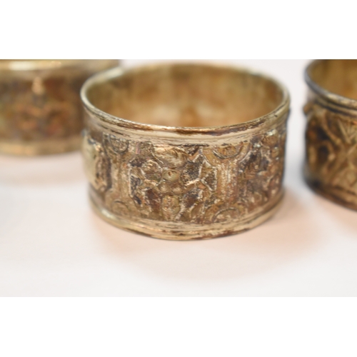 283 - A set of six Indonesian white metal napkin rings in original box marked for Rangoon together with on... 