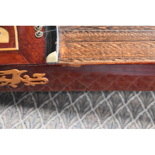 313 - A Chinese Guzheng or zither, made in the traditional form, with hard wood base, fretwork compartment... 