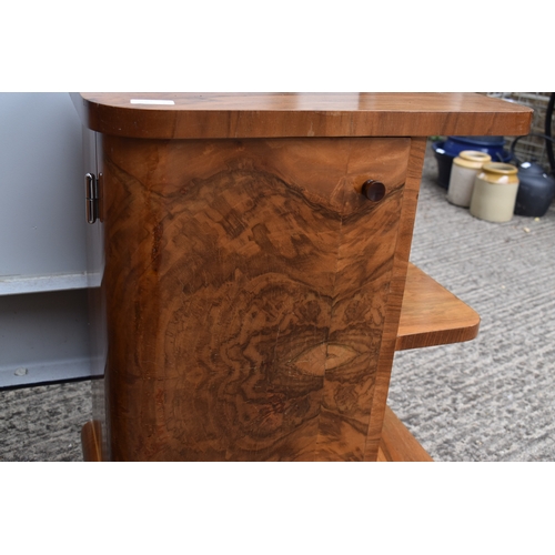 485 - A pair of Art Deco walnut veneer bedside tables, of curvilinear design with bakelite handles, 50 by ... 