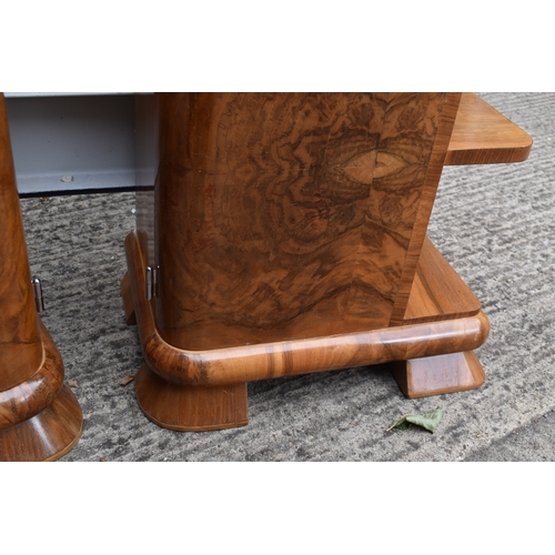 485 - A pair of Art Deco walnut veneer bedside tables, of curvilinear design with bakelite handles, 50 by ... 