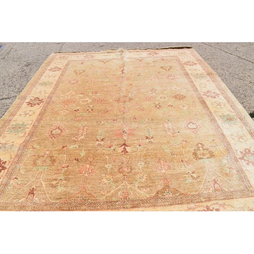 454 - A large Zeigler rug, with a cream ground, decorated with stylised foliate motifs, 4m by 3.17m. This ... 