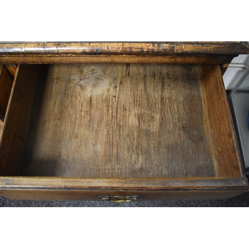 486 - An 18th century walnut chest of two over three drawers, with swan neck handles and brass lock plates... 