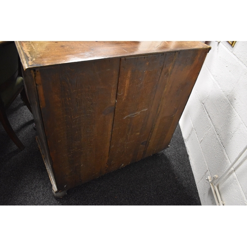 486 - An 18th century walnut chest of two over three drawers, with swan neck handles and brass lock plates... 