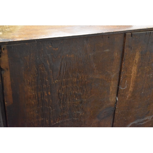 486 - An 18th century walnut chest of two over three drawers, with swan neck handles and brass lock plates... 