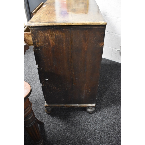 486 - An 18th century walnut chest of two over three drawers, with swan neck handles and brass lock plates... 