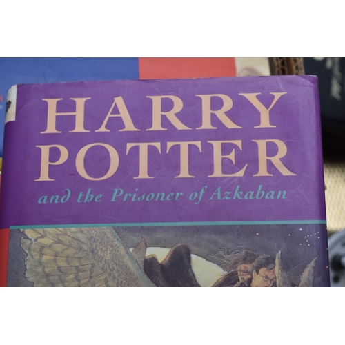 325 - A collection of J K Rowling books, comprising Harry Potter and The Prisoner of Azkaban, armorial pla... 