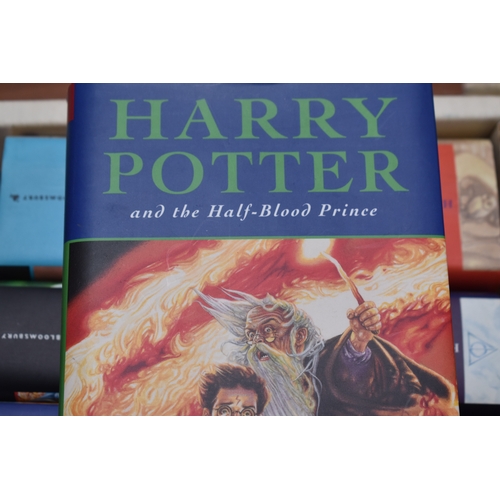 325 - A collection of J K Rowling books, comprising Harry Potter and The Prisoner of Azkaban, armorial pla... 