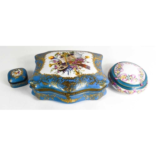 42 - A Russian Gardner porcelain box, with turquoise blue ground bordering the vista painted with a music... 