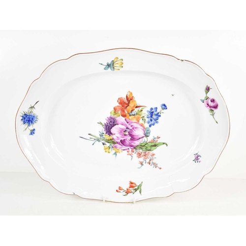 59 - A 19th century Meissen large serving plate of shaped rectangular form, painted with Deutsche Blumen,... 