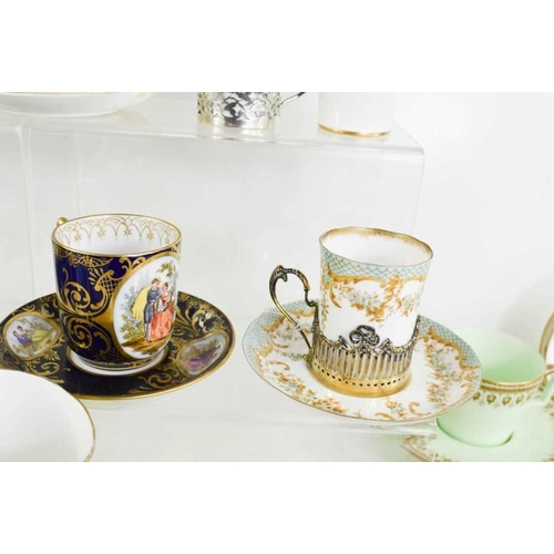 9 - A selection of fine porcelain coffee demitasse, including examples with silver holders. The various ... 