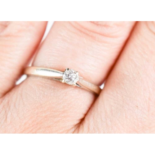 108 - A 9ct white gold and diamond solitaire ring, the single stone of approximately 0.01ct, size M, 1.63g... 
