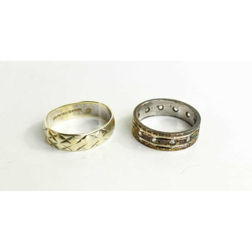 109 - A 9ct white gold wedding band, with crossover diagonal detailing, size N, 3.6g and 9ct gold and silv... 