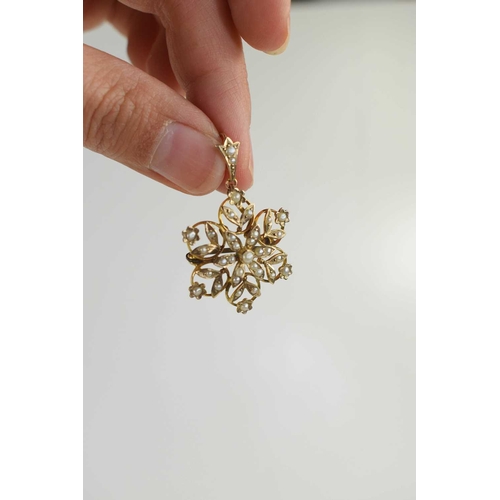 136 - A 9ct gold and seed pearl pendant / brooch, of snowflake or flowerhead form, set with seed pearls, o... 