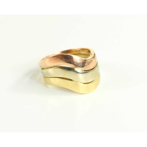 139 - A 9ct tri-colour gold wave ring, size L/M, 6.6g.