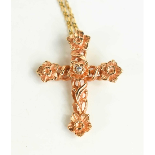159 - A Stuart Develin 14ct gold pendant 'The Gold & Diamond Cross', with chain and certificate, 6.8g.