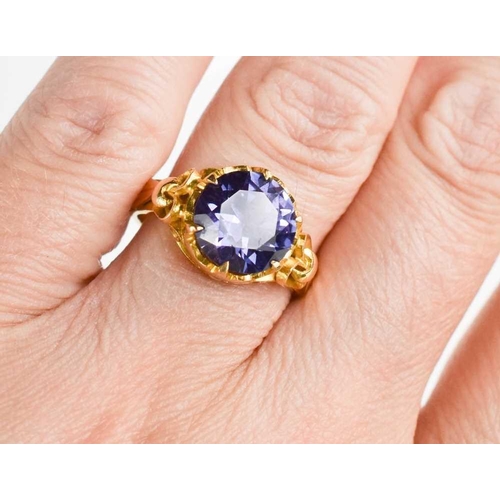 192 - A 22ct gold and deep purple sapphire ring, size N/O, 5.75g, together with an unmarked pair of earrin... 