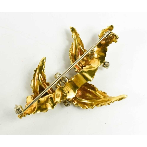 197 - An 18ct gold, diamond and enamel brooch, in a modernist foliate form, composed of three 'leaves' on ... 