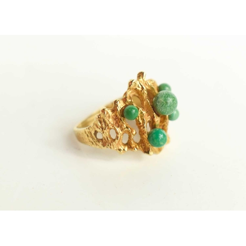 209 - A late 1960's 9ct gold and jade dress ring in the brutalist style, marks worn but likely maker L.J, ... 