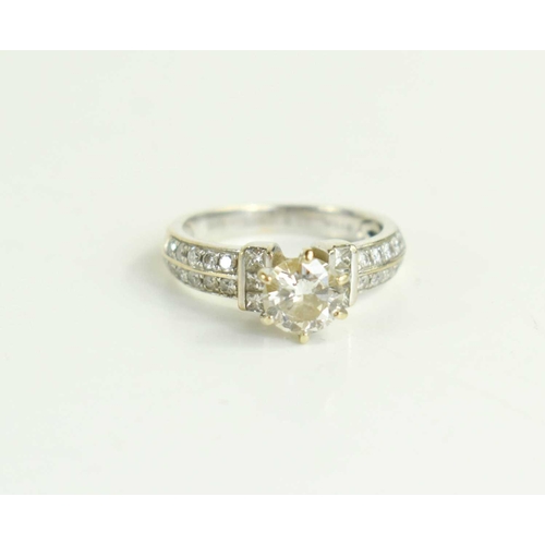 216 - An 18ct white gold and diamond solitaire ring, the central claw set brilliant cut stone of approxima... 