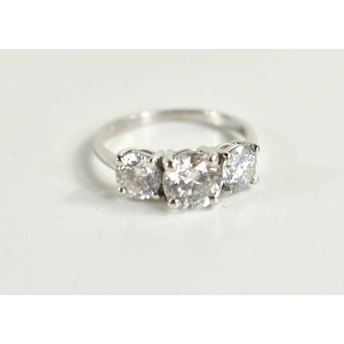 220 - An 18ct white gold and diamond trio ring, the three brilliant cut diamonds with central stone approx... 